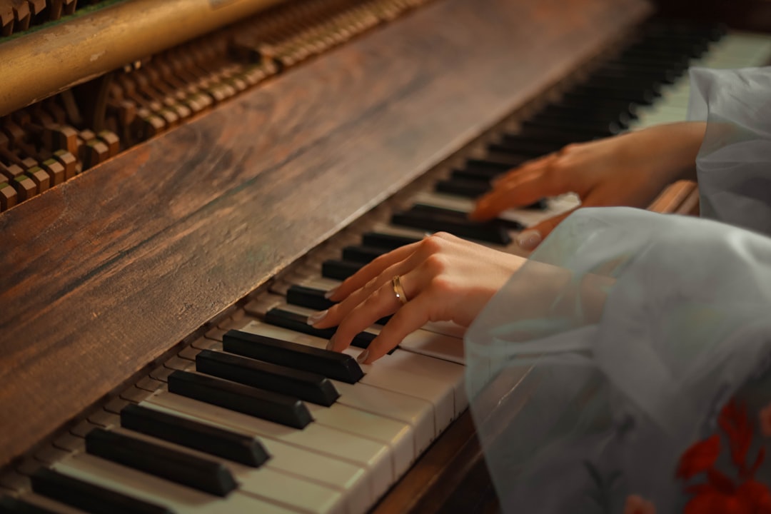 a close up of a person playing a piano