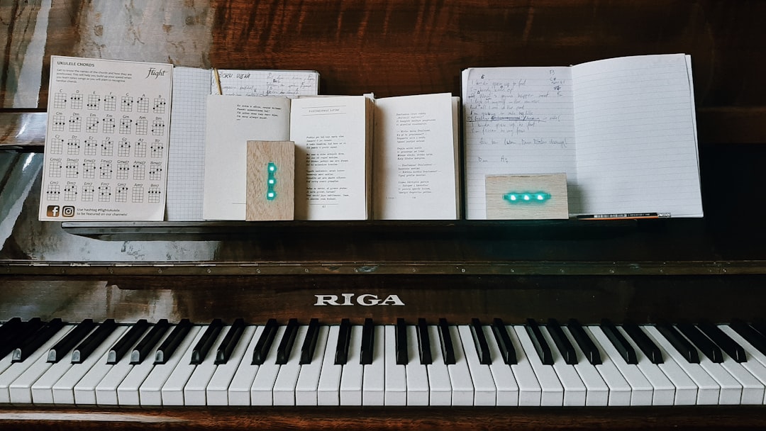 A close up of a piano with notes on it