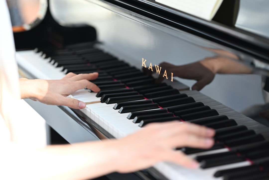 a person playing a piano with their hands