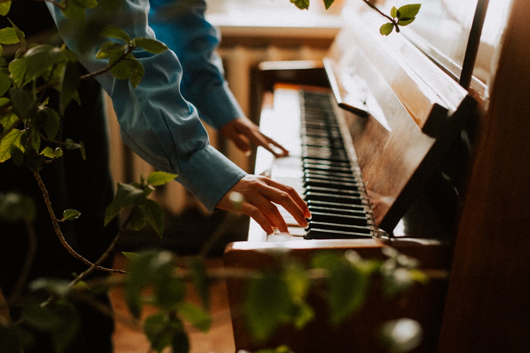 a person playing a piano in a room