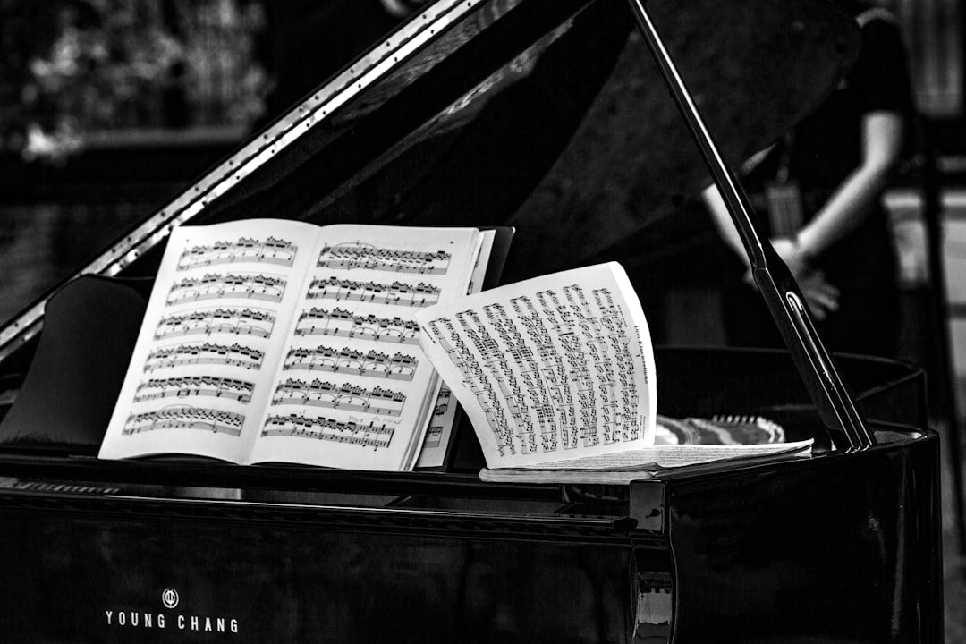 a piano with a sheet of music on top of it