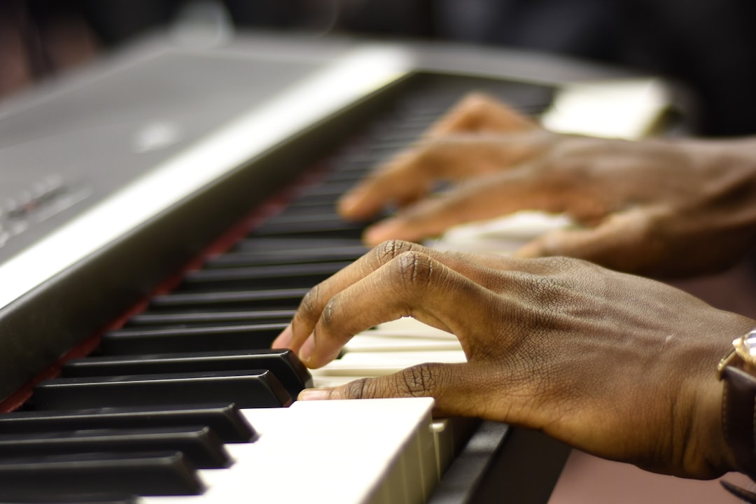 a close up of a person playing a piano